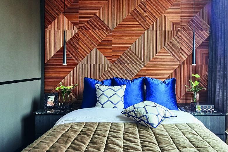 The bedroom’s feature wall comprises about 3,000 timber strips that were painstakingly pieced together.