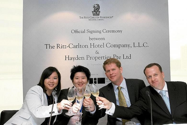 (From left) Ms Suparman with KOP co-founder Ong Chih Ching and Ritz-Carlton executives at the official signing ceremony for The Ritz-Carlton Residences in 2008. KOP group chief executive Leny Suparman recalls how even as a child, she was always inter