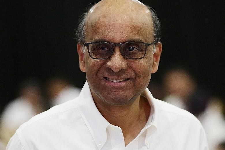 Senior Minister Tharman Shanmugaratnam on a video call with a migrant worker in Taman Jurong on Friday. Mr Tharman is an MP for Jurong GRC, which covers Taman Jurong.