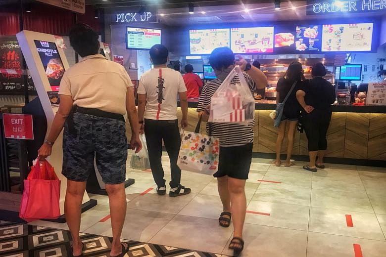 Customers at the KFC outlet at Tiong Bahru Plaza during lunchtime last Monday, a day after McDonald’s shut all its outlets temporarily.