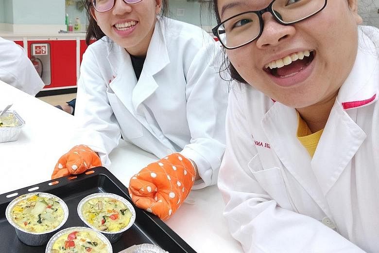 Ms Vernice Vee (at right), who took pharmacy science at Ngee Ann Polytechnic, has applied to go to the National University of Singapore. She is seen here with course mate Natasha Teo. PHOTO: VERNICE VEE