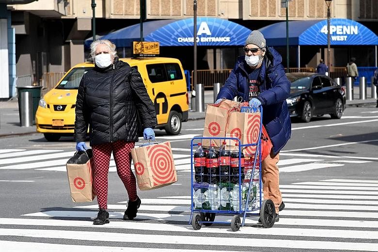 People out shopping in New York last Saturday. The US Centres for Disease Control and Prevention has registered an increase in calls of people exposing themselves to or ingesting cleaners and disinfectants
