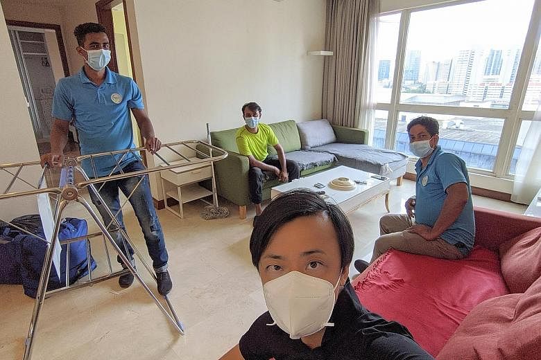 Mr Clarence Chua (foreground) managed to move three of his employees - (from left) Mr Ibrahim Darzi, Mr Md Jowel Rana and Mr Roy Kumar - out of Sungei Tengah Lodge to an apartment in Bugis.
