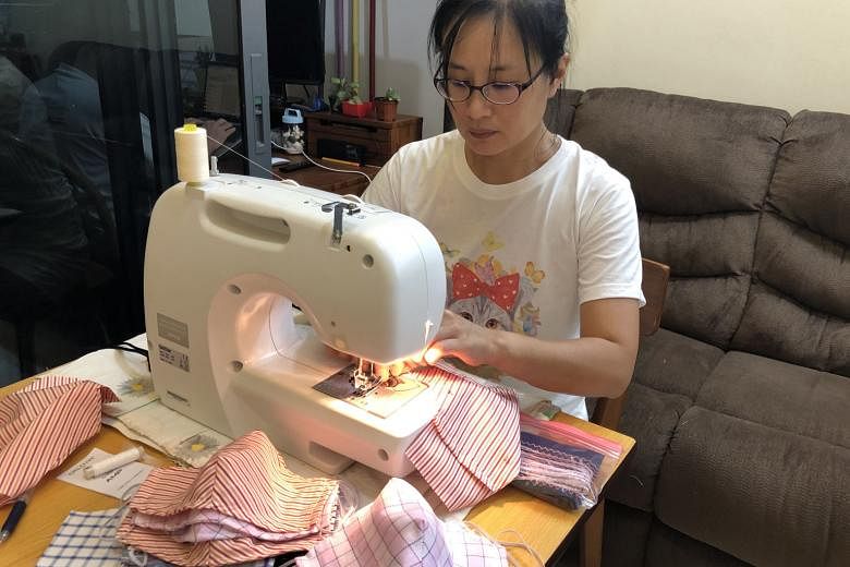 Madam Choong Chui Ping, a volunteer at Buddhist charity Tzu Chi Foundation (Singapore), sews masks from 8pm to 11pm every day. The cloth masks are distributed to those who have trouble getting surgical masks, such as migrant workers, the elderly and 