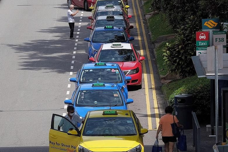 A long queue of taxis waiting for passengers at Bukit Merah Central yesterday. Transport is one of the sectors hit hard by the circuit breaker measures. ST PHOTO: GAVIN FOO