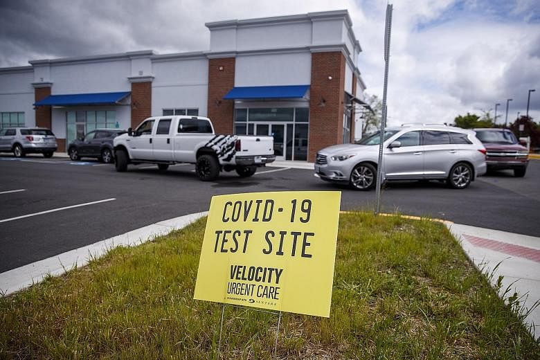 Above: Cars lining up outside the Velocity Urgent Care clinic that is open for coronavirus testing in Woodbridge, Virginia, on Monday. Right: A woman gesturing to a driver at a drive-through testing site set up by the Los Angeles Fire Department in I