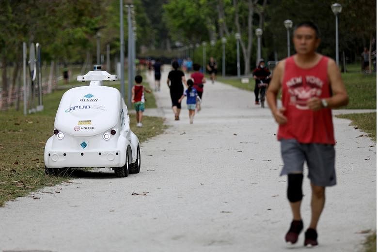 The O-R3 is an autonomous robot used by water agency PUB to broadcast safe-distancing messages at Bedok Reservoir park.