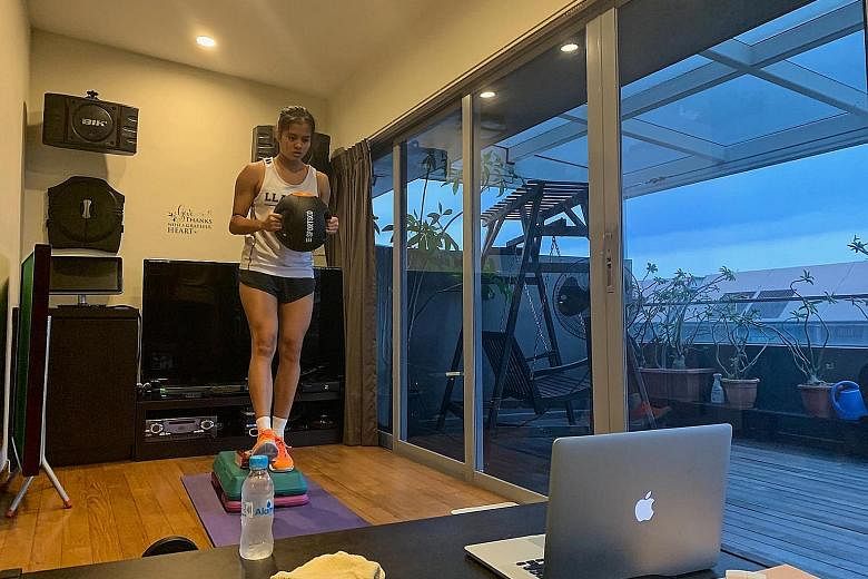 Rachel Ling taking part in one of the national netball team's gym sessions over Zoom. Opens team newcomer Pooja Senthil Kumar has been using a mini basketball hoop and a scrunched-up piece of paper to practise her shooting in her living room during t