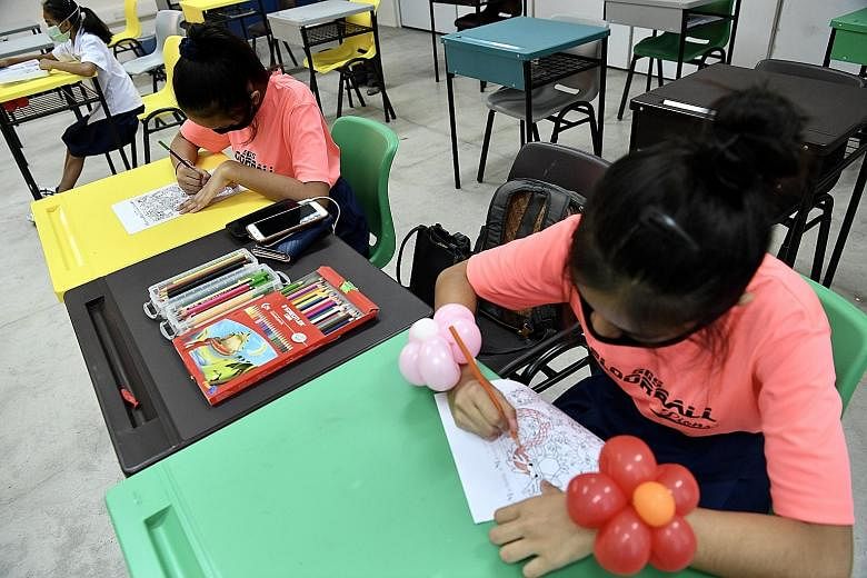 Secondary 2 students at Serangoon Garden Secondary working in class on April 22 during the home-based learning period. Teachers made arrangements for a small number of children who, for various reasons, wanted to do their learning in school. ST PHOTO
