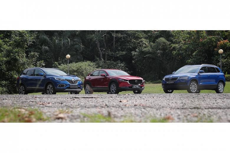 (Above from left) The Renault Kadjar, Mazda CX-30 and Skoda Karoq may not come to mind when shopping for a sport utility vehicle, but these cars are worth a second look. 