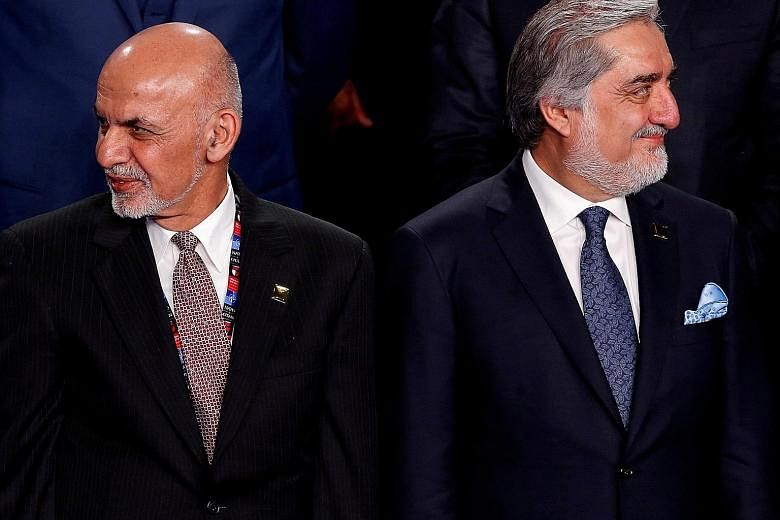 Afghan President Ashraf Ghani (left) and Mr Abdullah Abdullah, seen here in a 2016 file photo, have drafted a deal to resolve the stand-off over last year's disputed presidential election.