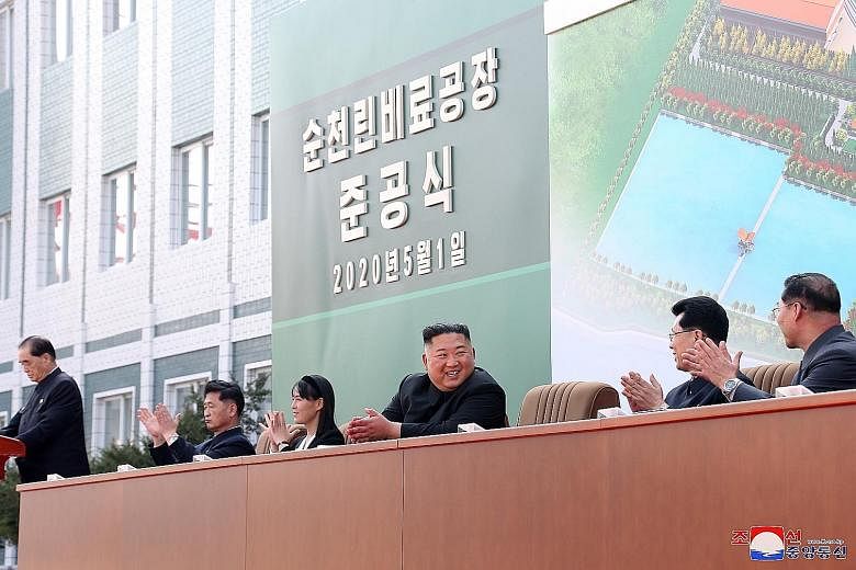 North Korean leader Kim Jong Un attending an event to mark the completion of a fertiliser plant north of Pyongyang on Friday, accompanied by his sister Kim Yo Jong and senior officials.