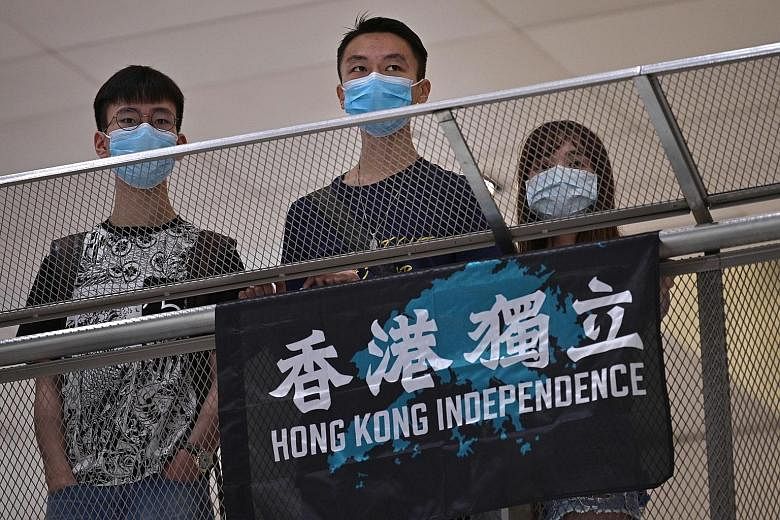 Hong Kong pro-democracy protesters at a shopping mall in the Shatin district on Friday. China's Liaison Office said "extremist radicals" were involved in illegal gatherings, and in harassing shops and throwing petrol bombs during May Day demonstratio