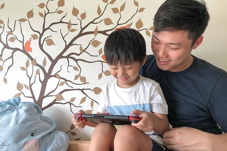 Dr Andrew Yee with his son, Noah. Dr Yee believes that parents should not see devices as the “enemy” but as useful tools for education. 