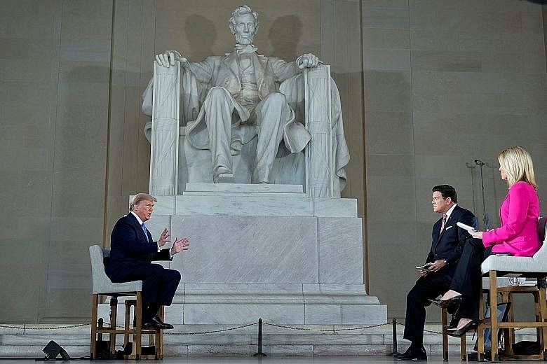 With a two-hour-long Fox News "town hall" at the iconic Lincoln Memorial on Sunday, President Donald Trump sought to wrap himself in the mantle of America's arguably greatest president - and to persuade a nation battered by death and mass unemploymen