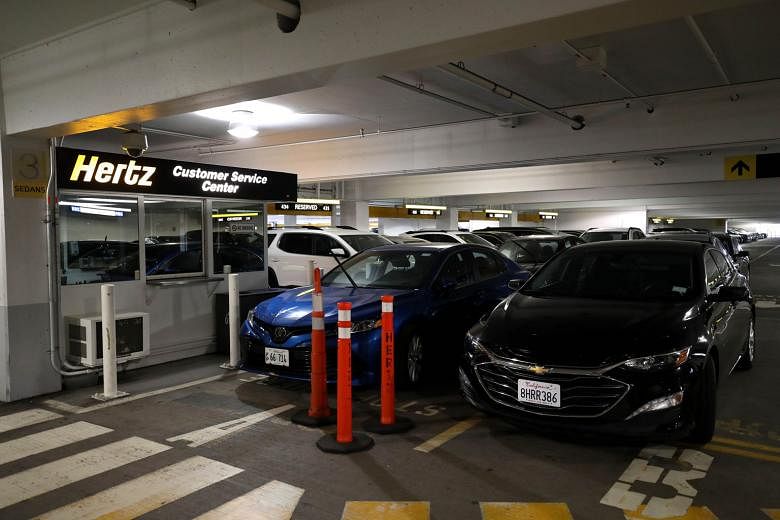 Hertz cars at San Francisco International Airport last week. The rental-car company recently disclosed that it had missed substantial lease payments related to its rental cars.