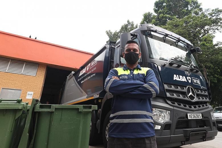 Garbage truck driver Kalaiarasan Tamilchelvan has been working three hours longer than usual these days. Every day, he drives to 25 neighbourhoods within the Jurong region to collect waste and makes about five trips to the waste collection facility i