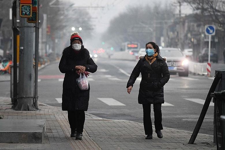 A polluted February day in Beijing. NTU researchers have proposed a model that may explain how and why air pollution primes the airways for poorer Covid-19 outcomes.