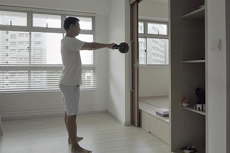 Designed by home owner Soh Chee Lip, the two-room HDB flat gives the content marketeer space to think, work out (above) and relax.