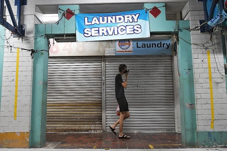 Mr Dobi Laundry Services in Yishun is one of the laundry shops that may not reopen yet, while some shops are planning to resume business with shorter opening hours and others are saying they will not allow walk-in customers. ST PHOTO: KHALID BABA