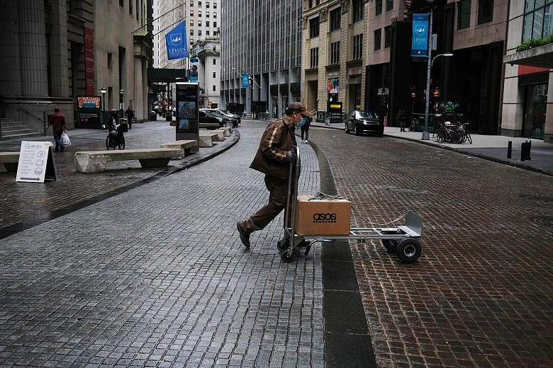 A view on Friday of the financial district of New York City, which is under lockdown during the coronavirus pandemic. The United States, the largest economy in the world, has been hit hard by Covid-19, with the unemployment rate climbing to 14.7 per 