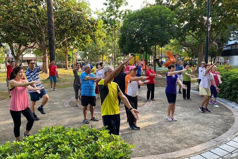 Participants of the Happy programme doing physical and mental exercises at Jalan Pari Burong prior to the circuit breaker.