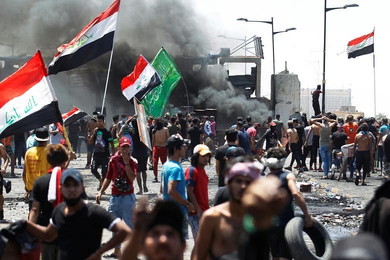 Iraqi demonstrators taking part in an anti-government protest at Al-Jumhuriyah bridge in Baghdad yesterday, days after Prime Minister Mustafa Kadhemi's government came to power. The rallies first erupted in the Iraqi capital and Shi'ite-majority sout