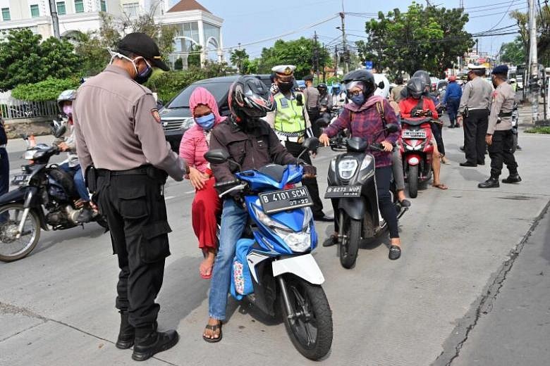 Coronavirus: Toilet duty for Jakarta's social distancing violators ...