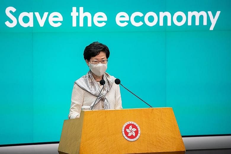 Chief Executive Carrie Lam at a news conference in Hong Kong yesterday. She has said it is necessary for school curriculum reforms that would foster a "national identity", a move which could prompt further protests.