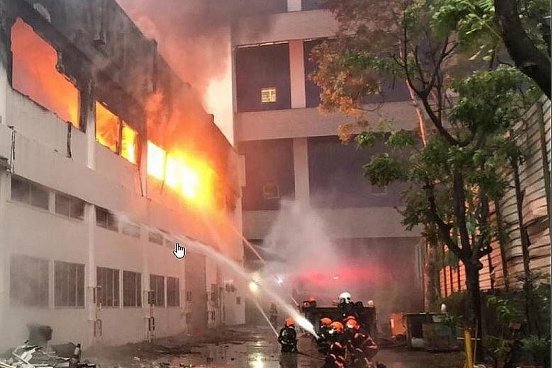 The heat from the second-storey blaze at a Tuas warehouse was so intense that some walls broke off. Contents of the warehouse comprising machinery and bales of plastic resin were engulfed in the flames, but there were no reported injuries.