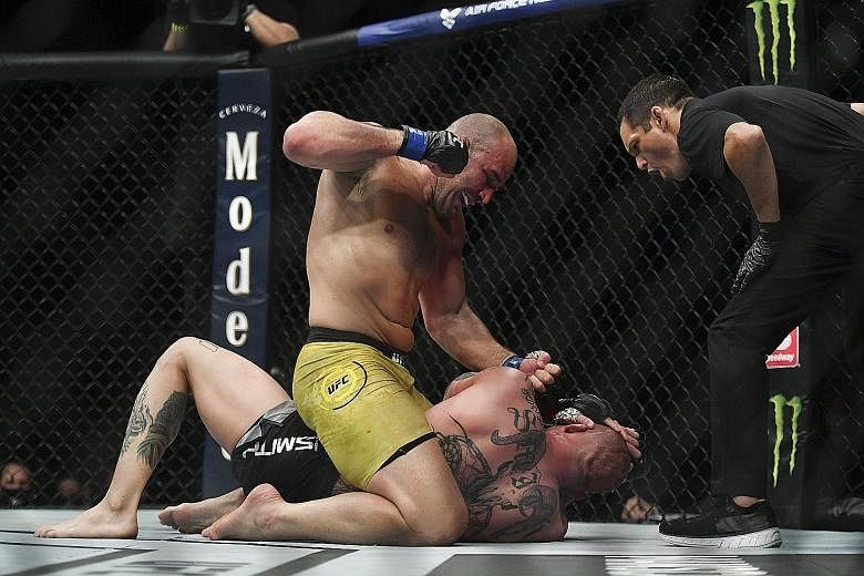 Glover Teixeira (in yellow) defeated Anthony Smith with a fifth-round TKO in a one-sided light heavyweight bout that headlined the Ultimate Fighting Championship's Fight Night in Jacksonville, Florida on Wednesday. Brazil-born Teixeira floored his Am