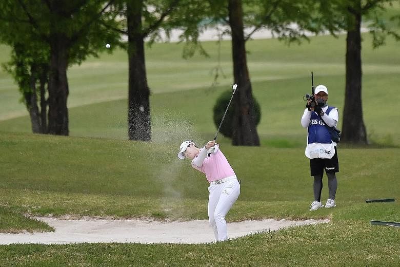 Park Sung-hyun blasting out of a bunker on the 18th hole during the first round of the KLPGA Championship at Lakewood Country Club in Yangju, South Korea. She finished her round with a 73, six behind the pace as the world's third-ranked player and ot
