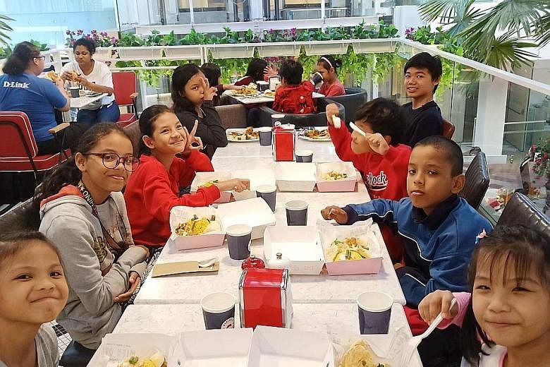 The Straits Times School Pocket Money Fund beneficiaries at a charity night in celebration of Perennial Real Estate Holdings' 10th anniversary and The Capitol Kempinski Hotel's first anniversary on Dec 6 last year. About 10,000 students from low-inco