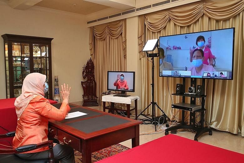 President Halimah Yacob chatting with residents and care staff of the Singapore Christian Home via videoconferencing yesterday. Speaking to the media later, she noted that the care staff have put in tremendous effort for the residents, and sacrificed