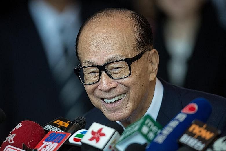 Hong Kong's richest man Li Ka Shing's flagship companies CK Hutchison Holdings and CK Asset Holdings have warned of significant drops in profit and income respectively.
