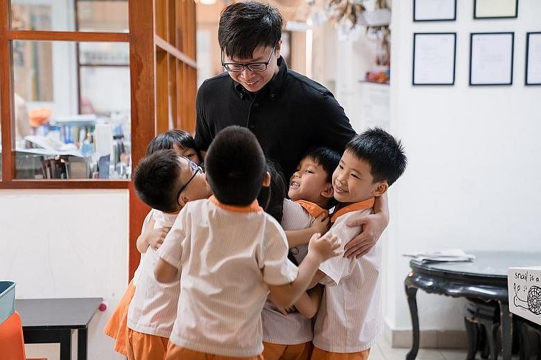 Singaporean conductor Wong Kah Chun with pupils from non-profit education centre Child at Street 11, as part of Project Infinitude, which aims to enrich the children's lives with music.