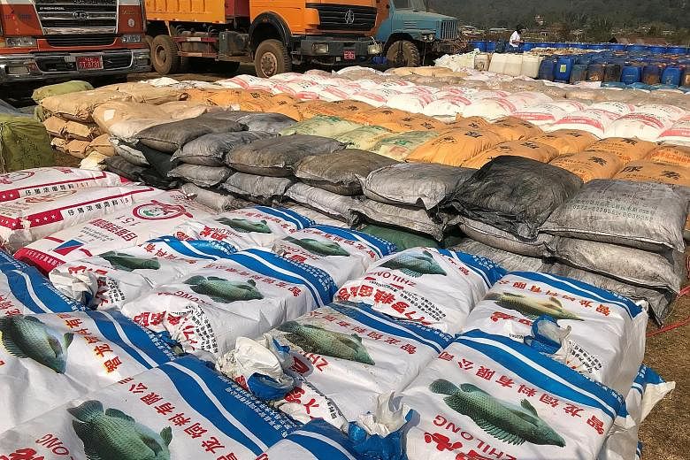 Precursor chemicals used to make illicit drugs seized by Myanmar's police and the military near Loikan village in Shan state.