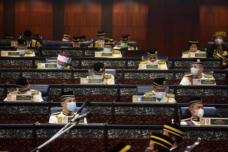 Malaysian Prime Minister Muhyiddin Yassin (bottom right) and other MPs at yesterday's parliamentary session in Kuala Lumpur. Only the King's speech was scheduled for the sitting, leaving no chance for the MPs to discuss the confidence vote against Ta