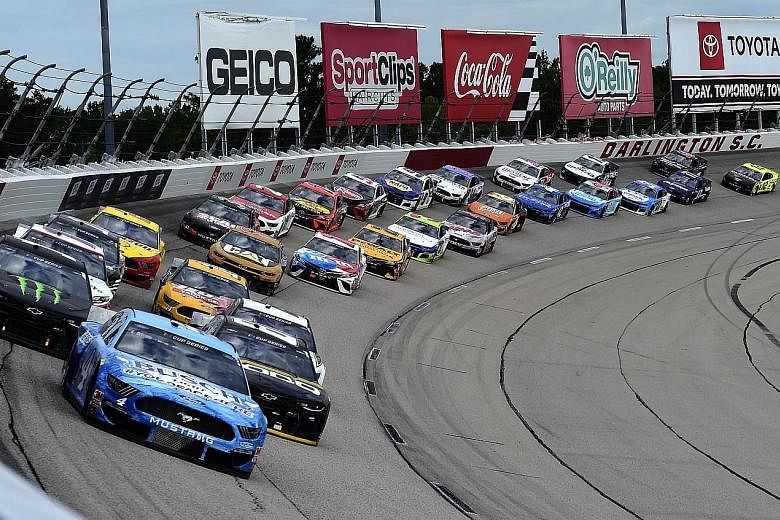 Eventual winner Kevin Harvick leading the field during the Real Heroes 400 race at the Darlington Raceway on Sunday. It was the first race of the Nascar series after a two-month hiatus due to the coronavirus pandemic. PHOTO: AGENCE FRANCE-PRESSE