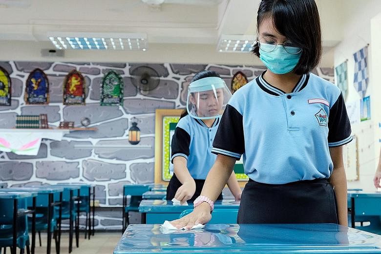 Schools must put in place hygiene practices when they reopen, such as having students wipe down surfaces before leaving the classroom.