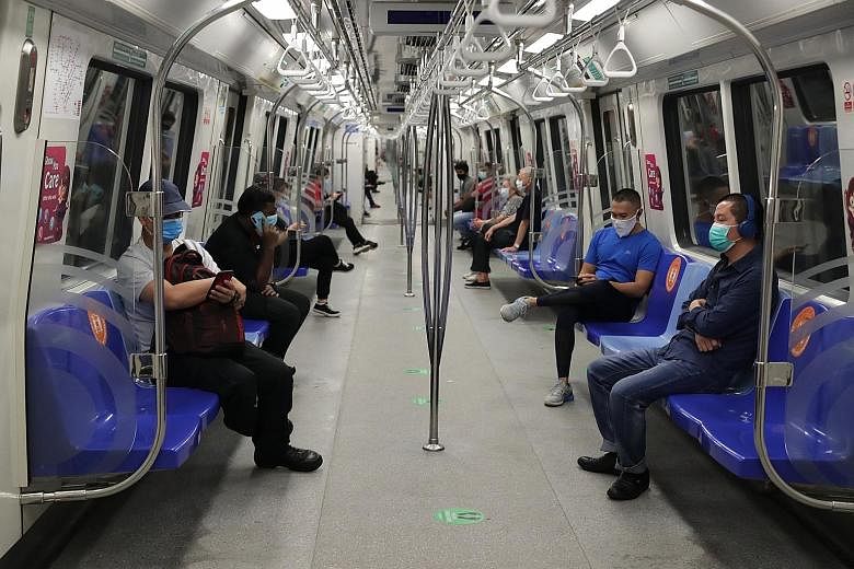 National Development Minister Lawrence Wong said ridership on public transport will rise as curbs are eased and physical distancing will be harder, so the focus will be on other safe management measures for public transport. ST PHOTO: GIN TAY