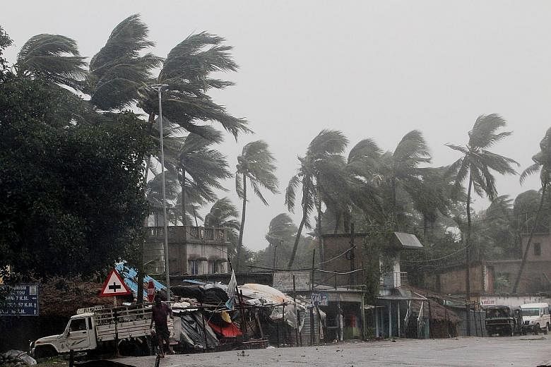 Heavy rain and strong winds lashing Paradeep on India's Odisha coast yesterday as Cyclone Amphan approached. About 650,000 people have been moved to safety in Odisha and West Bengal, the authorities said. PHOTO: EPA-EFE