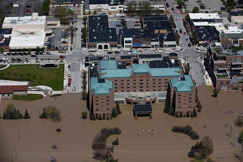 Parts of downtown Midland in Michigan, United States, submerged by flood waters on Wednesday, after two dam failures. PHOTO: BLOOMBERG