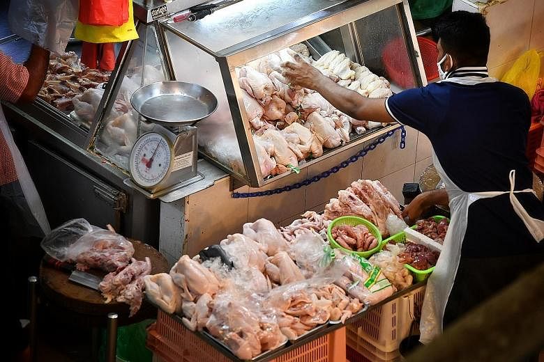 A poultry stall at Tekka Market. Some chicken sellers said although they had seen prices of chicken from Malaysia go up by about 20 to 30 cents per kg last month, they have been absorbing the increased costs.
