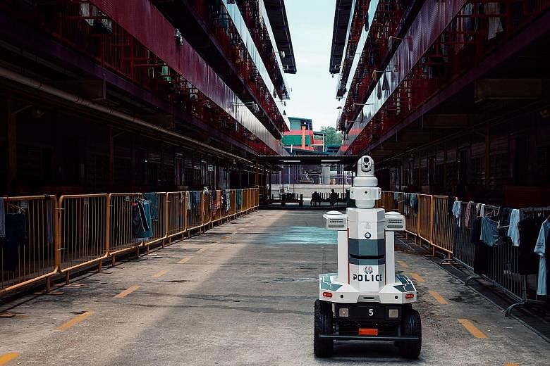 Two of the Multi-purpose All-Terrain Autonomous Robots, or Matar, are currently in a foreign workers' dormitory in the eastern part of Singapore. Equipped with cameras and speakers, they can patrol areas on their own, with an operator in a command ce