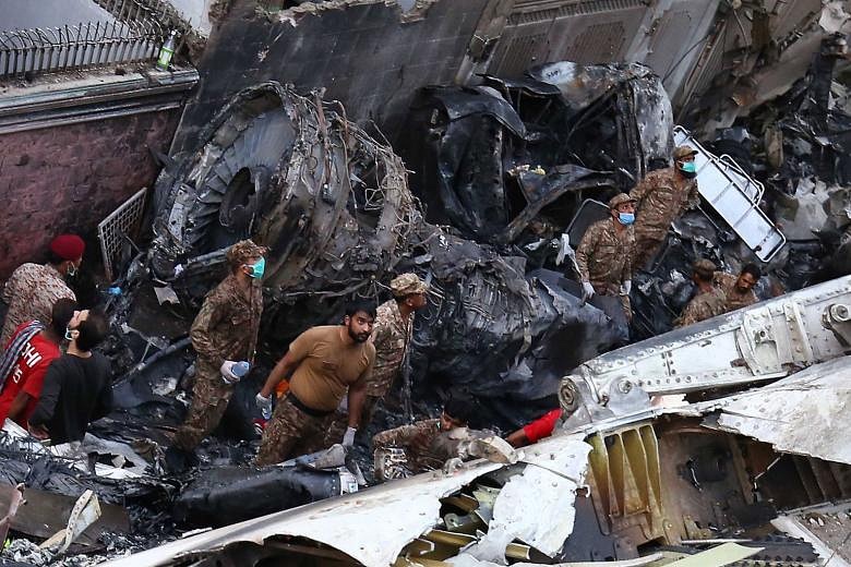 Bodies From The Sky Horror As Plane Crashes Among Homes In Pakistan   08437848 