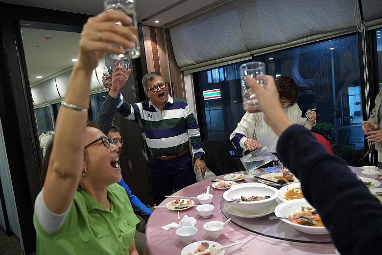 Steven and Lai Quen on a study trip to Taiwan last November, along with five others with dementia and their caregivers. The trip was organised by the Alzheimer's Disease Association and the Lien Foundation. Steven leading a toast at dinner during the