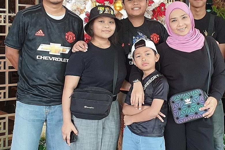Ms Linda Othman is preparing her schoolgoing sons Ryqe (back row, centre), 15, and Ryle (front row, centre), 10, for school by readjusting their sleeping hours. With them are her husband Rahmat Ramli, 43, a technical specialist; daughter Rhea, 16, who is 