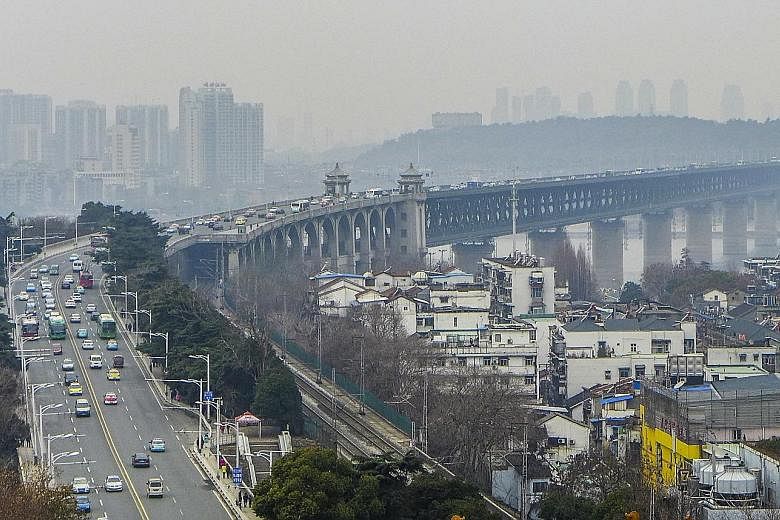 Completed in 1957, the Wuhan Yangtze River Bridge (above) was the first major bridge built over the Yangtze river. The lower level hosts a railway line and the upper deck has a highway and pedestrian paths.