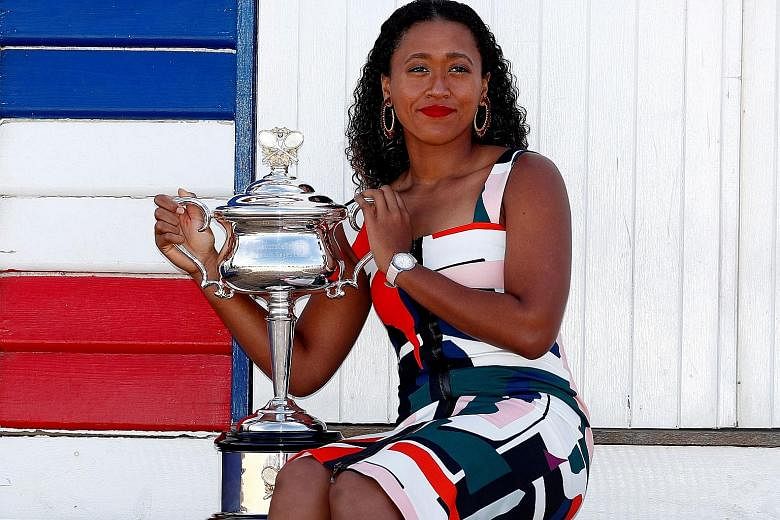 Naomi Osaka with her Australian Open trophy in January last year, when she reached world No. 1 after winning successive Grand Slam titles.